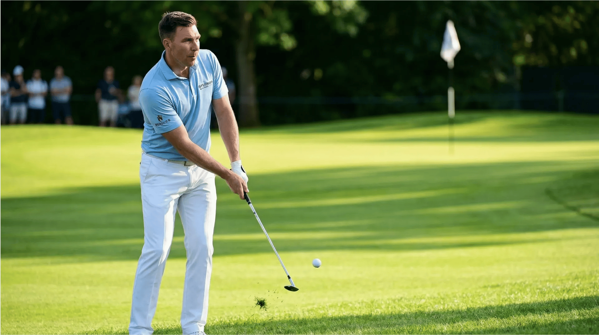 Tadd Bainton practicing a chip shot near the green